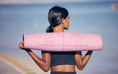 Buy stock photo Woman, fitness and yoga with mat at beach for outdoor workout, exercise or training in nature. Rear view of female person thinking with equipment for balance in health and wellness by ocean coast