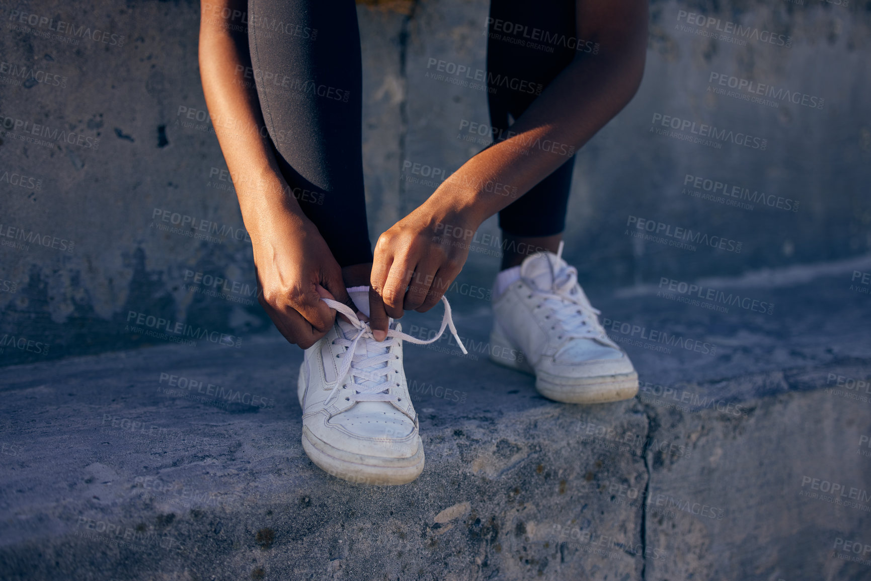 Buy stock photo Hands, fitness and tie shoes outdoor at steps to start workout, training or exercise in city. Sneakers, runner and person tying lace to prepare for sports, health or legs ready for wellness at stairs