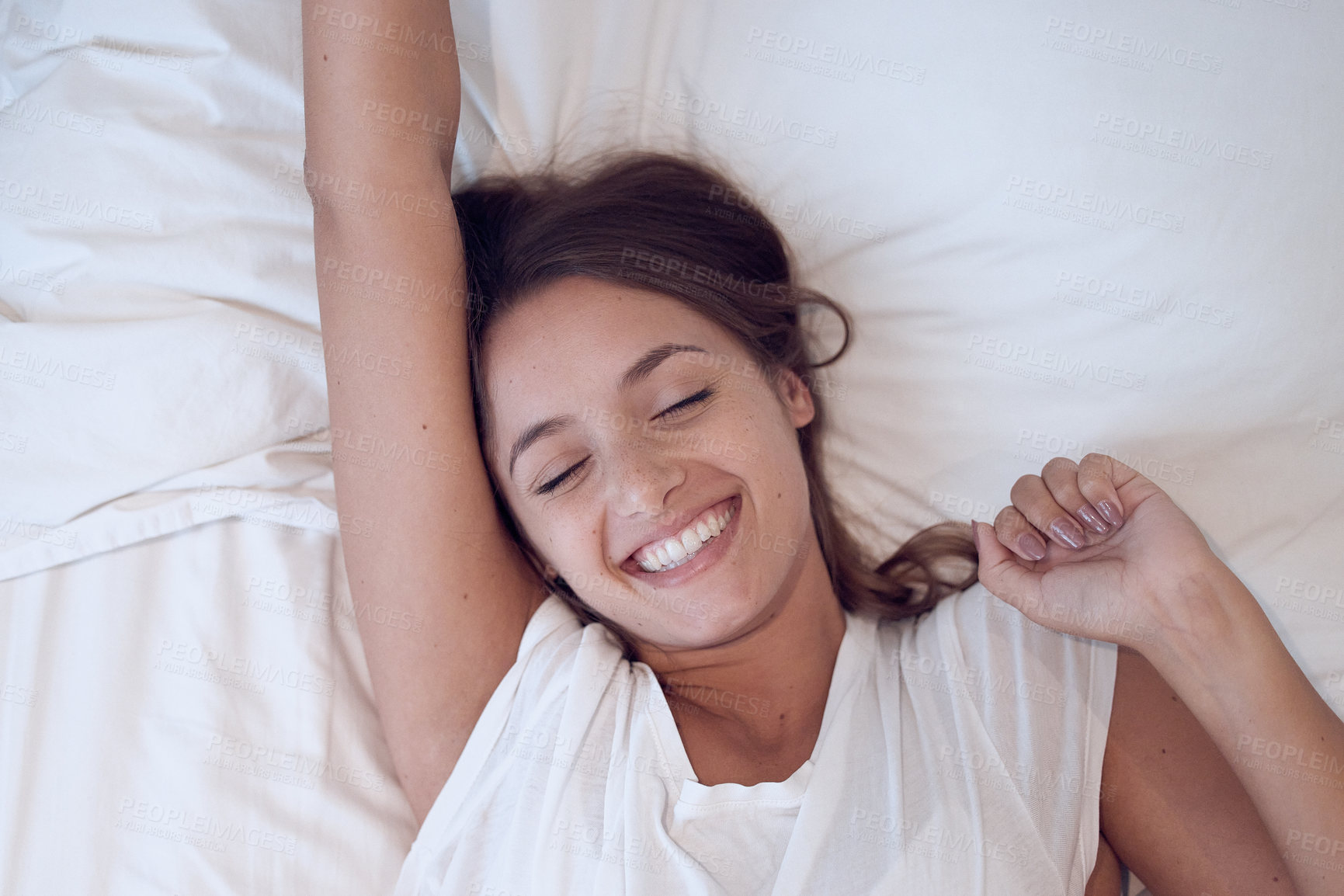 Buy stock photo Happy, woman and bed with morning stretch, wake up after rest and sleep. Excited, female person and pillow for peace, comfort and feeling fresh to start the day with smile, energy and healthy routine