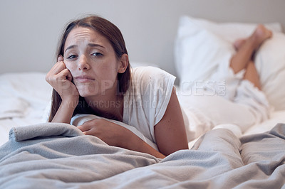 Buy stock photo Bored, depression and woman lying on bed for low energy, exhausted or insomnia in home. Fatigue, student and female person in bedroom for mental health, anxiety or stress from university in apartment