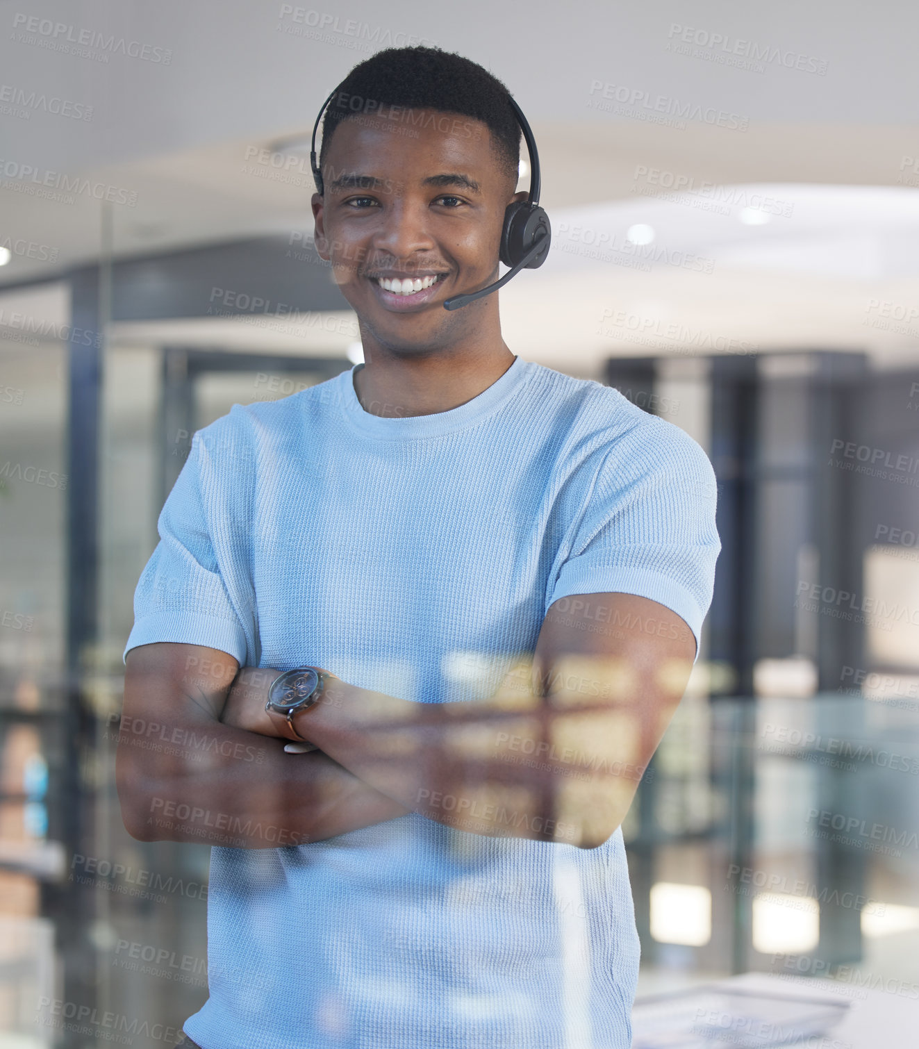 Buy stock photo Portrait of a young businessman working in a call centre