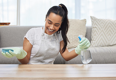 Buy stock photo Sponge, house and happy woman cleaning table, furniture surface or wood with liquid soap in spray bottle. Services, maid and cleaner laughing with gloves working to wash dirty, dusty or messy lounge