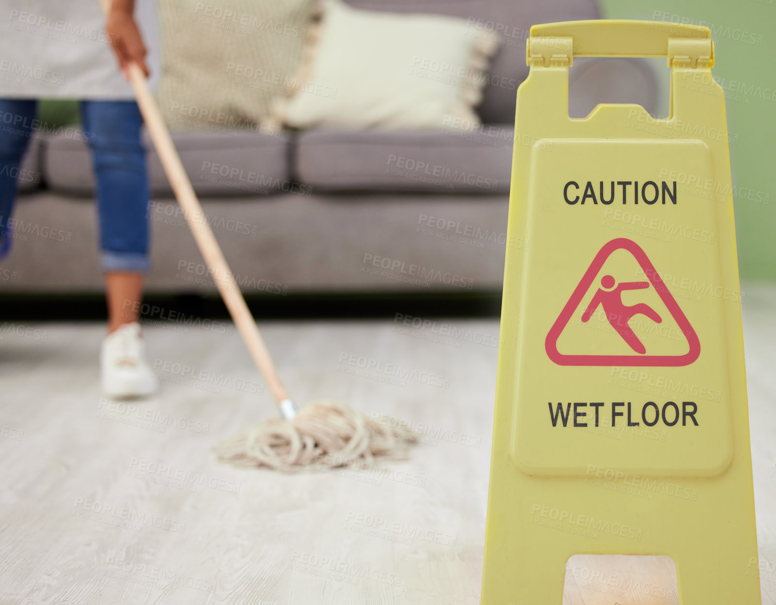 Buy stock photo Person, mopping and caution sign for wet floor, slippery and housekeeping maintenance for hygiene or disinfecting. housekeeper, cleaning and hospitality service in living room of home with warning.