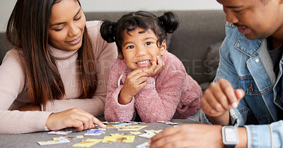 Buy stock photo Parents, girl and happy in portrait with puzzle in home for learning, development and love with bonding. Father, mother and daughter for games, teaching and problem solving at family house in Bogota