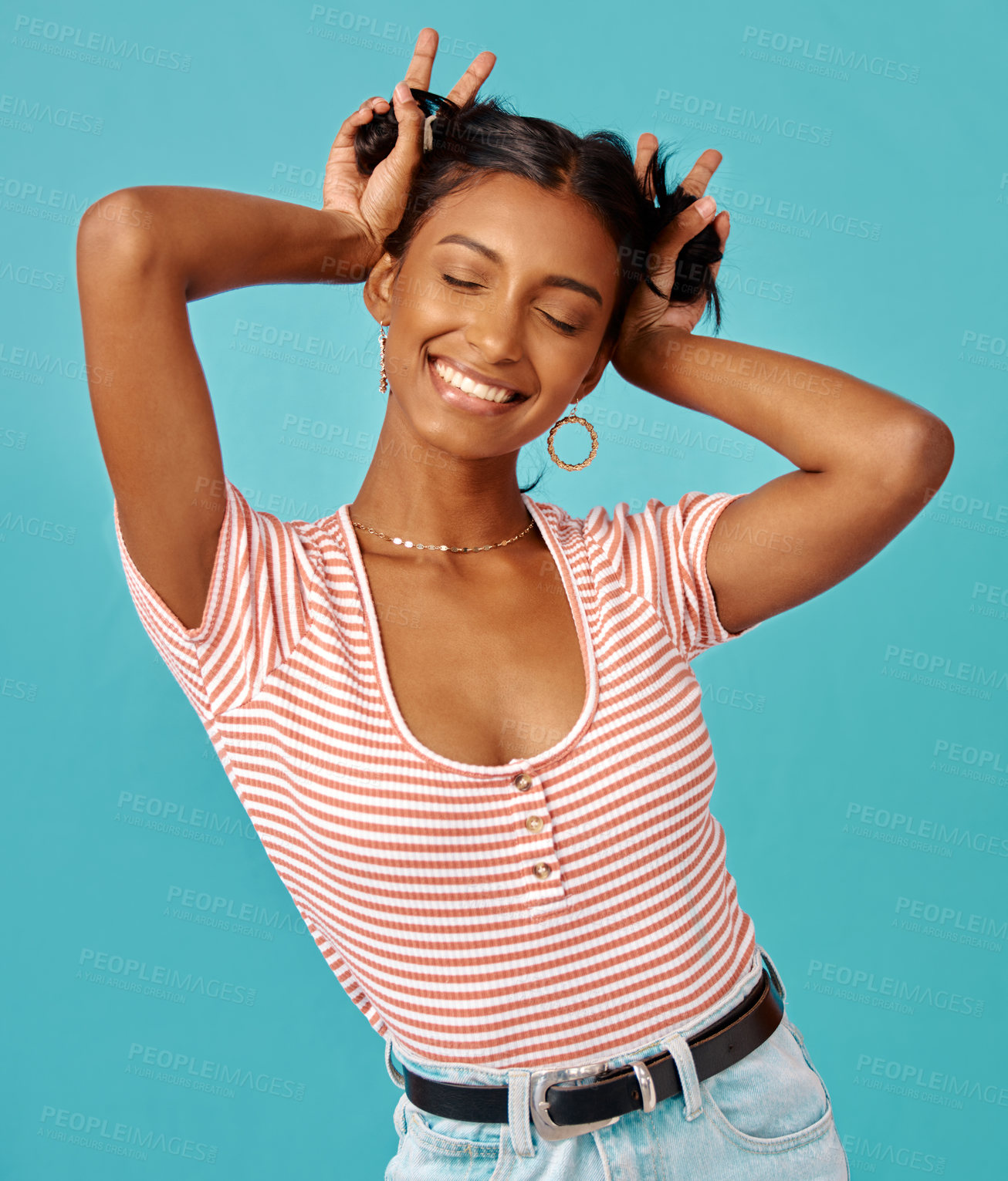 Buy stock photo Shot of a young woman posing shot against a studio background