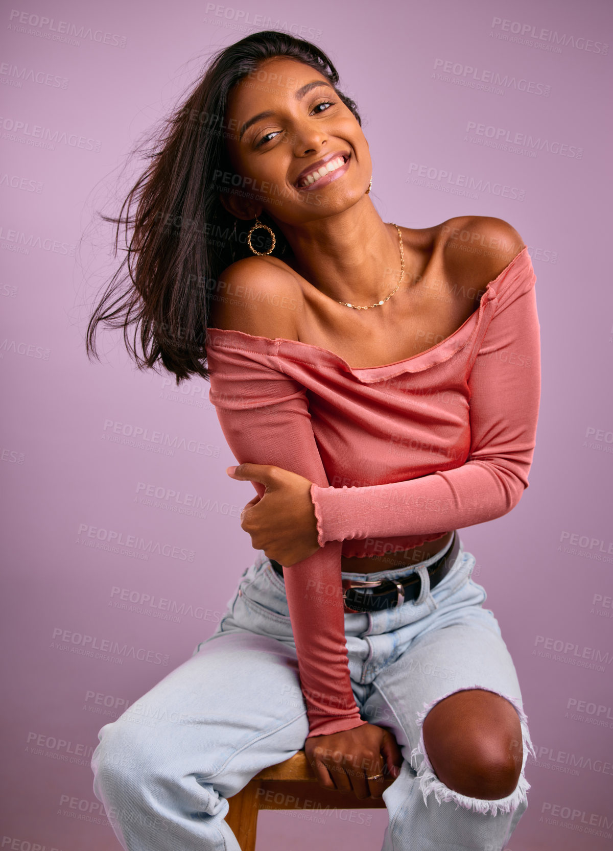 Buy stock photo Shot of a young woman smiling shot against a studio background