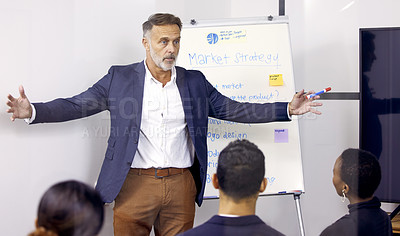 Buy stock photo Shot of a mature businessman giving a presentation in a boardroom at work