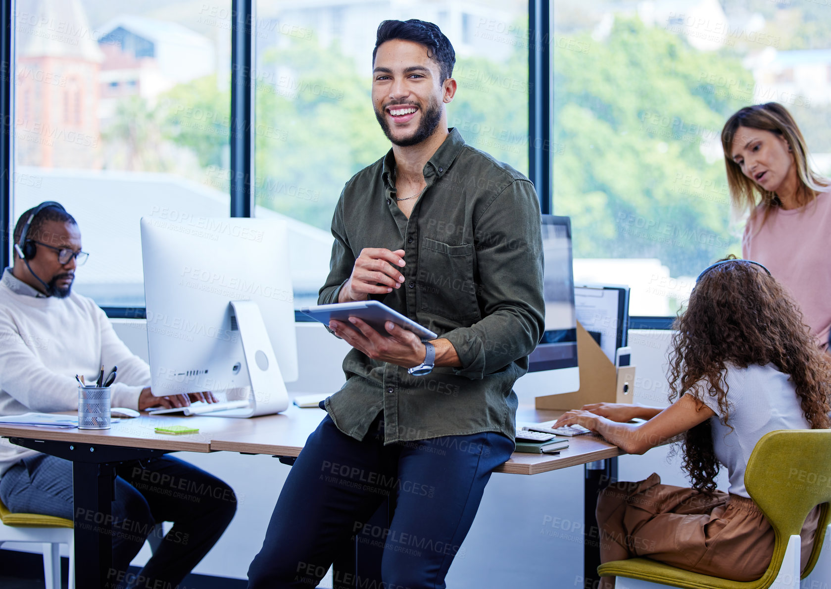 Buy stock photo Businessman, portrait and tablet on table in office with computer for business, work and career. Graphic designer, technology and smile in workplace for company, creative and startup with team