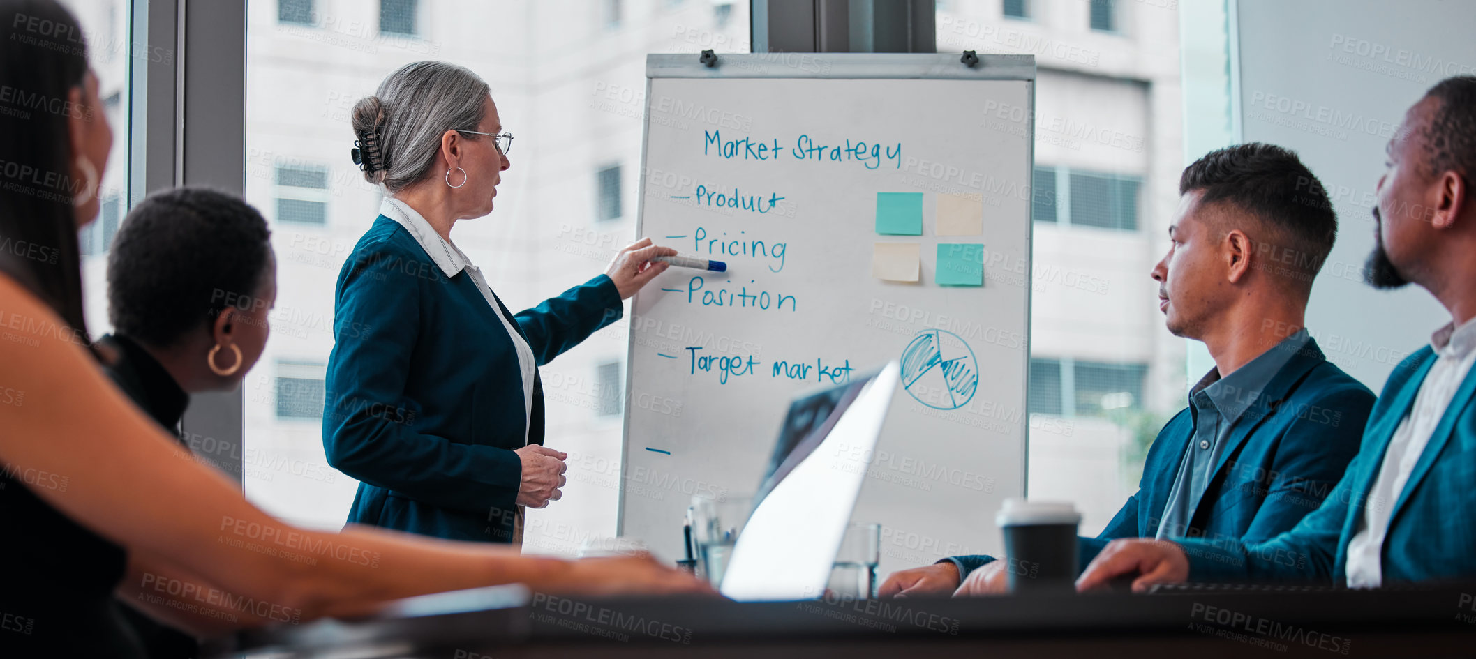 Buy stock photo Shot of a mature businesswoman giving a presentation at work