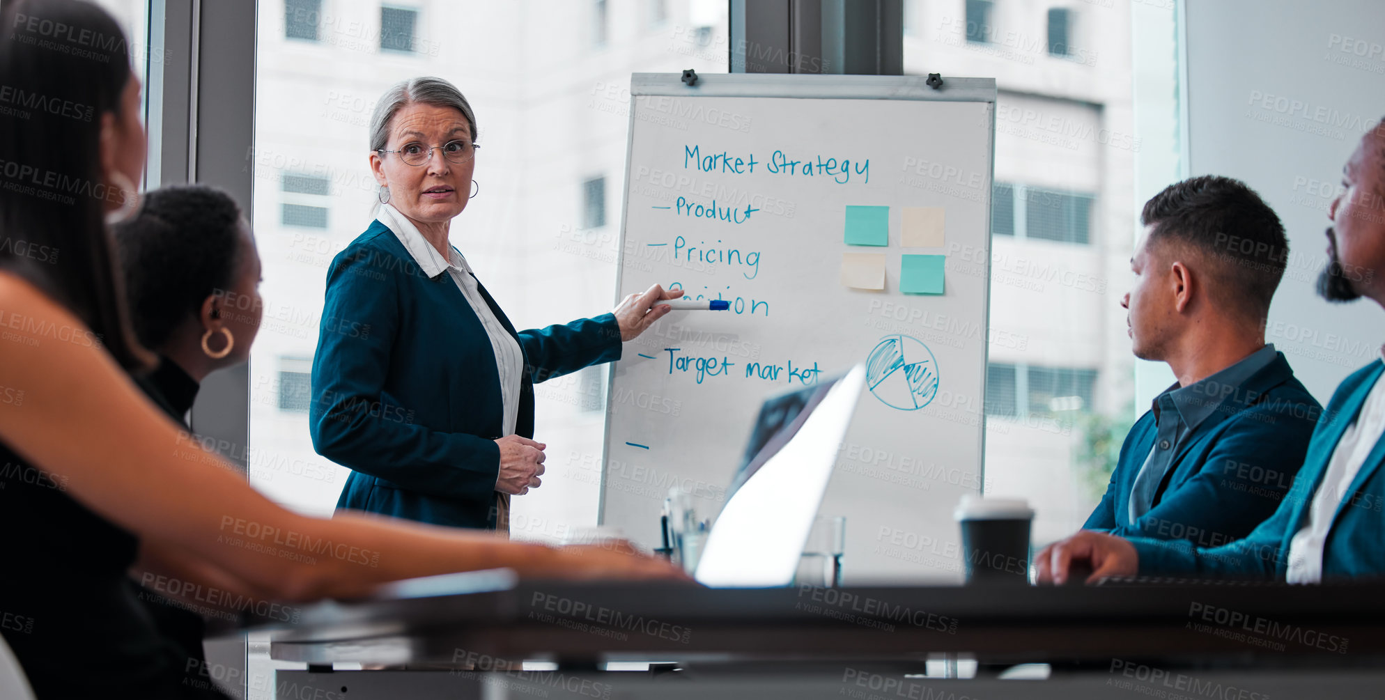 Buy stock photo Shot of a mature businesswoman giving a presentation at work
