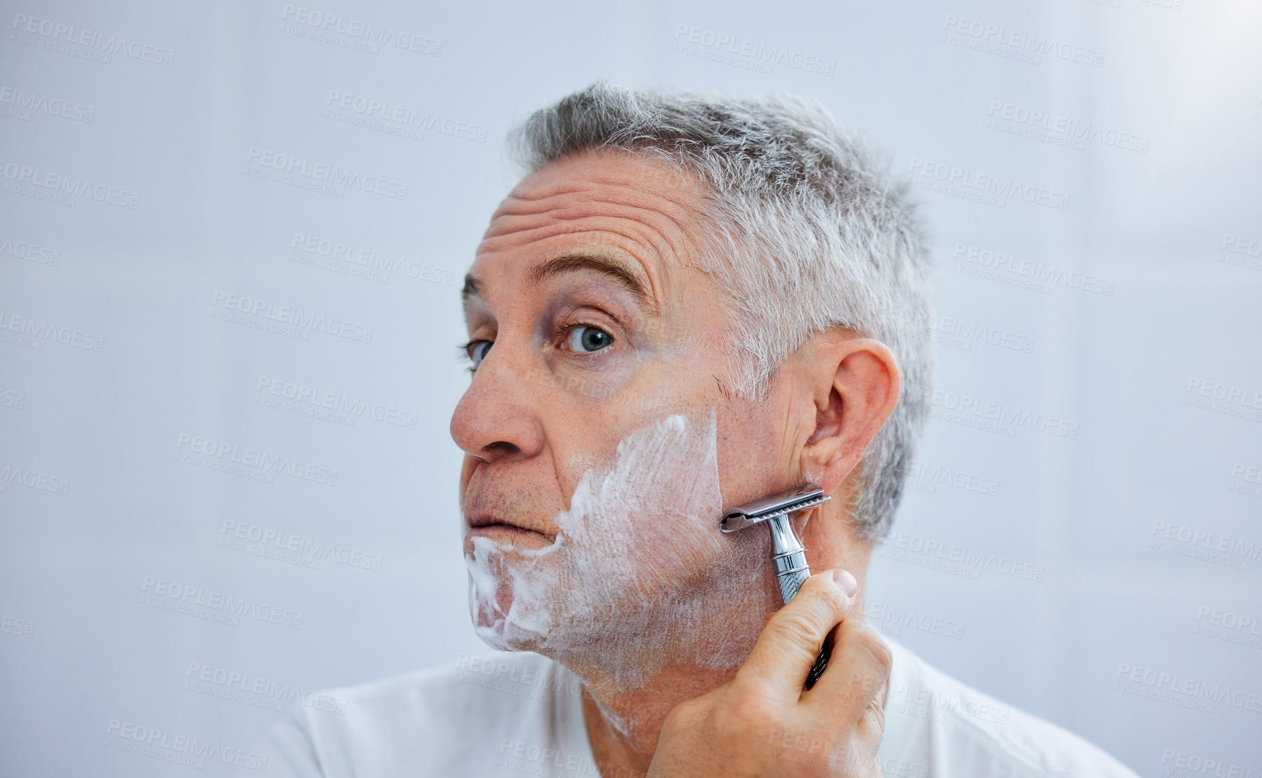 Buy stock photo Mature man, razor and shaving cream in home, beauty and tool or soap for skincare grooming in routine. Person, blade and cleaning or facial treatment for cosmetics, self care maintenance and hygiene