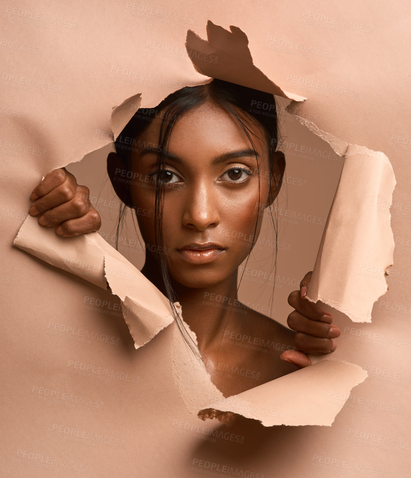 Buy stock photo Paper, hole or serious woman with portrait in studio for skincare, natural cosmetics or beauty aesthetic. Dermatology, exfoliation or person with skin peel for glow results, pride or brown background