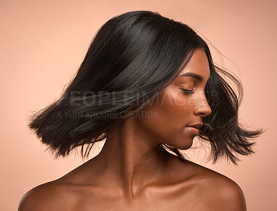 Buy stock photo Hair care, beauty and young woman in studio with keratin, healthy or brazilian salon treatment. Wellness, cosmetic and female model with motion for shiny, clean and soft hairstyle by brown background