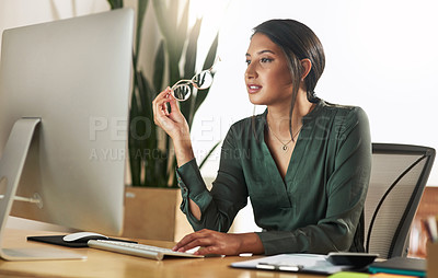 Buy stock photo Shot of a young businesswoman typing on her desktop PC keyboard