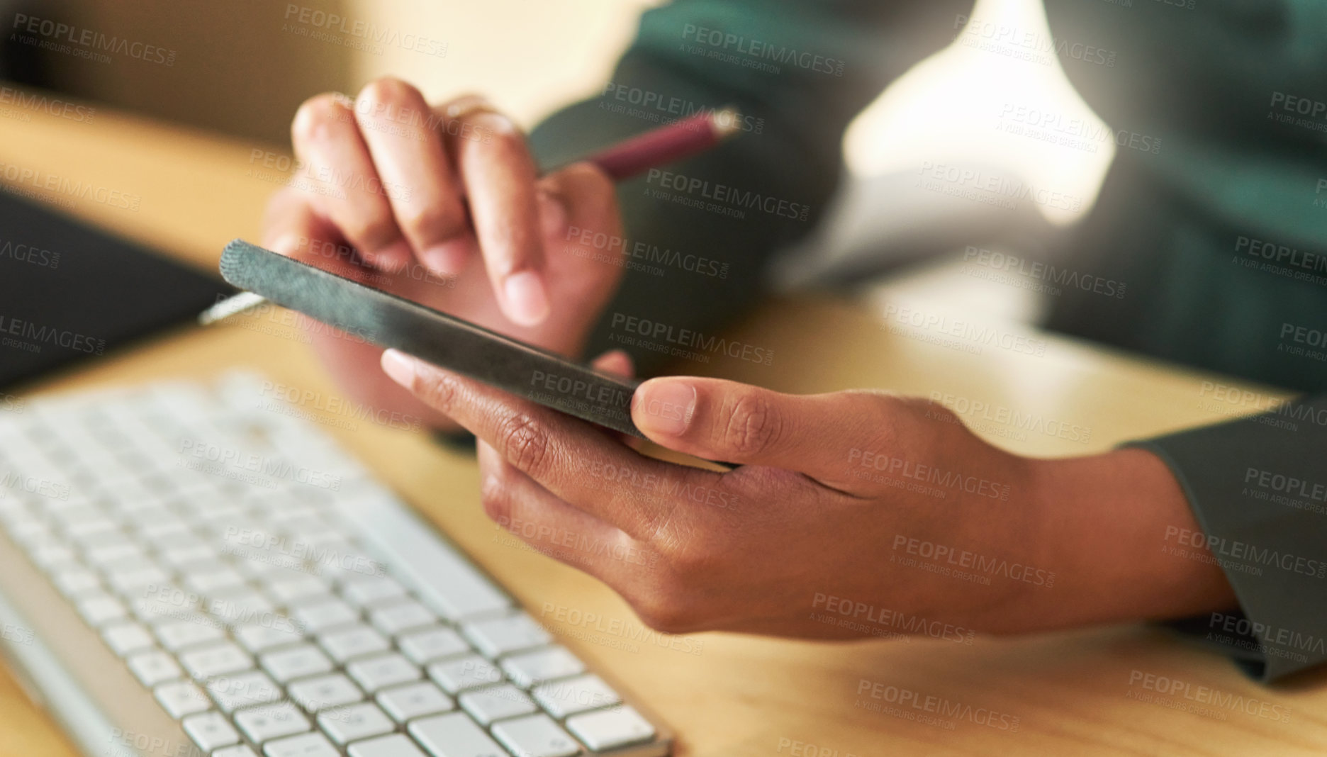 Buy stock photo Shot of a businesswoman using her smartphone at her desk