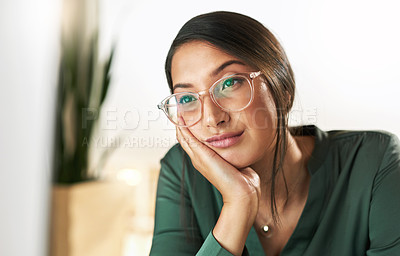 Buy stock photo Shot of a young businesswoman staring at her PC screen in boredom
