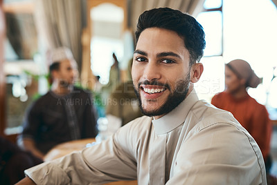 Buy stock photo Shot of a young businessman spending time with his family during ramadan