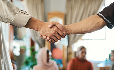 Buy stock photo Shot of two muslim men shaking hands in greeting
