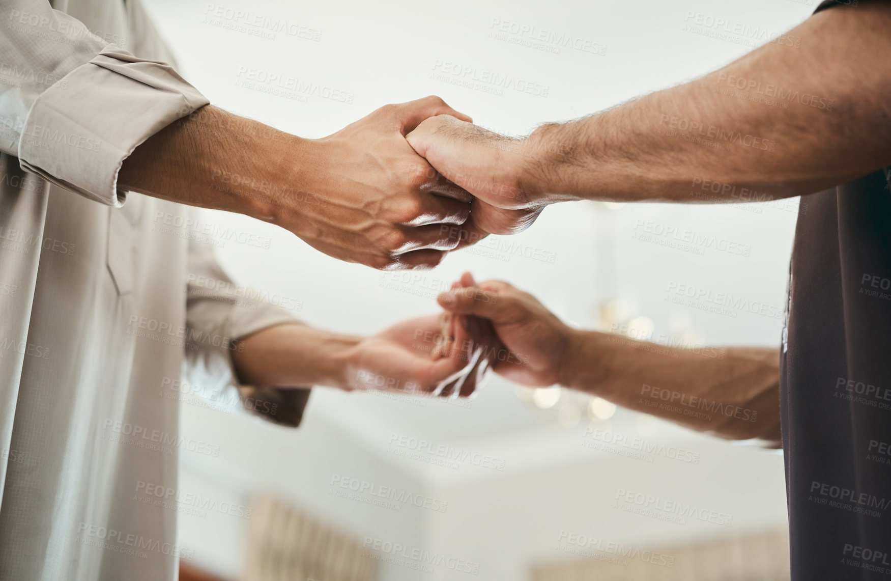 Buy stock photo Shot of two muslim men holding hands in prayer