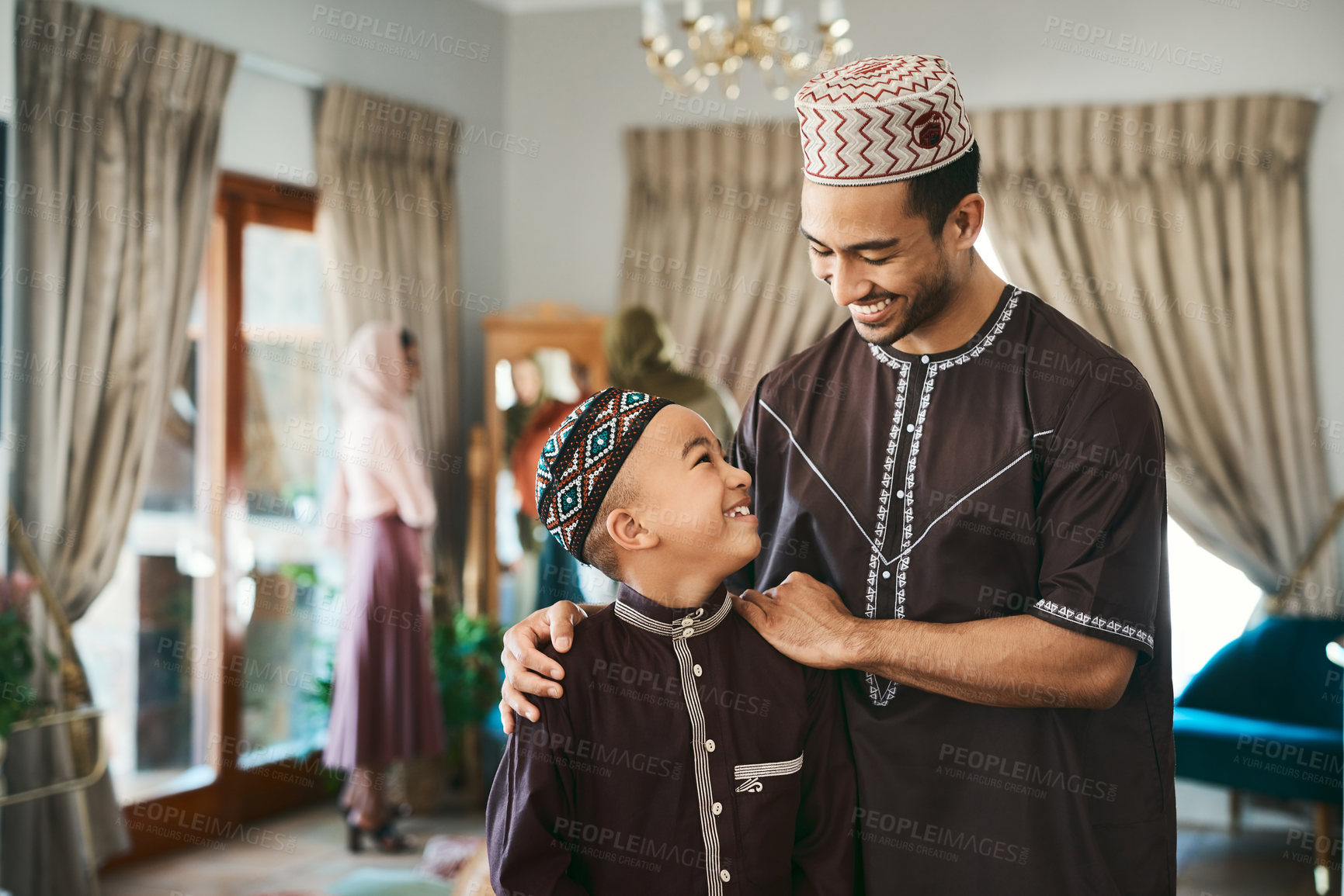 Buy stock photo Shot of a muslim father embracing his son