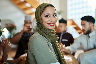 Buy stock photo Shot of a young muslim woman spending some time during ramadan with her family