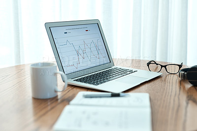 Buy stock photo Empty shot of a laptop and notebook on a table at home