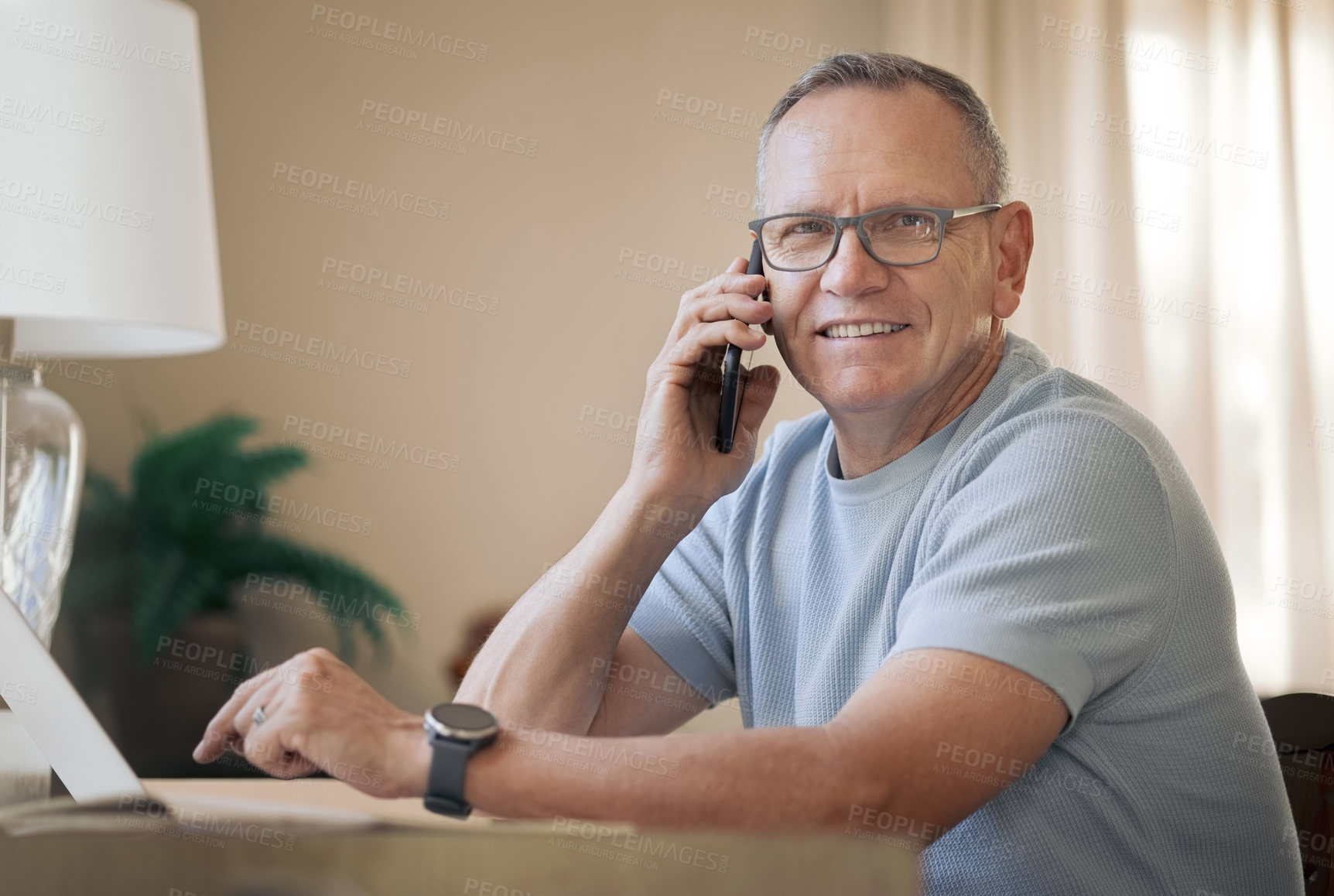 Buy stock photo Shot of a mature man using his smartphone to make a call