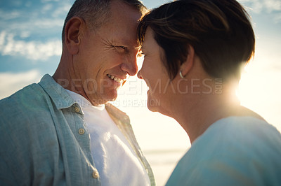 Buy stock photo Closeup shot of an affectionate couple spending the day at the beach