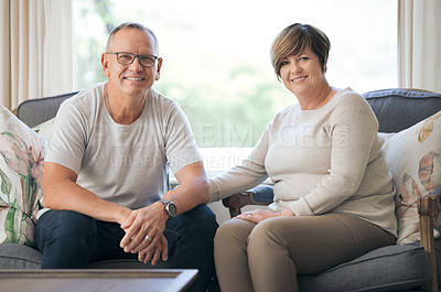 Buy stock photo Shot of a mature couple relaxing together at home