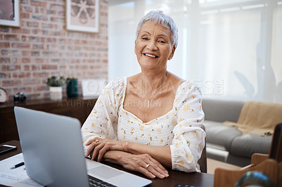 Buy stock photo Shot of a senior woman using a laptop at home