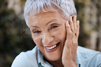 Buy stock photo Shot of a senior woman in the garden at home