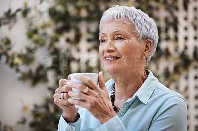 Buy stock photo Shot of a senior woman having coffee in the garden at home