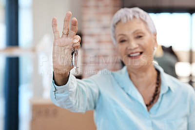 Buy stock photo Shot of a senior woman holding up the keys to her new home