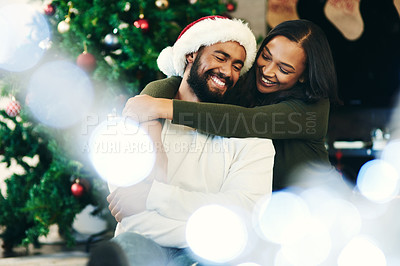 Buy stock photo Black couple, Christmas celebration and hug with love, enjoy the festive season and relax in living room of apartment home. Happy man, black woman hugging and celebrate xmas December holiday together