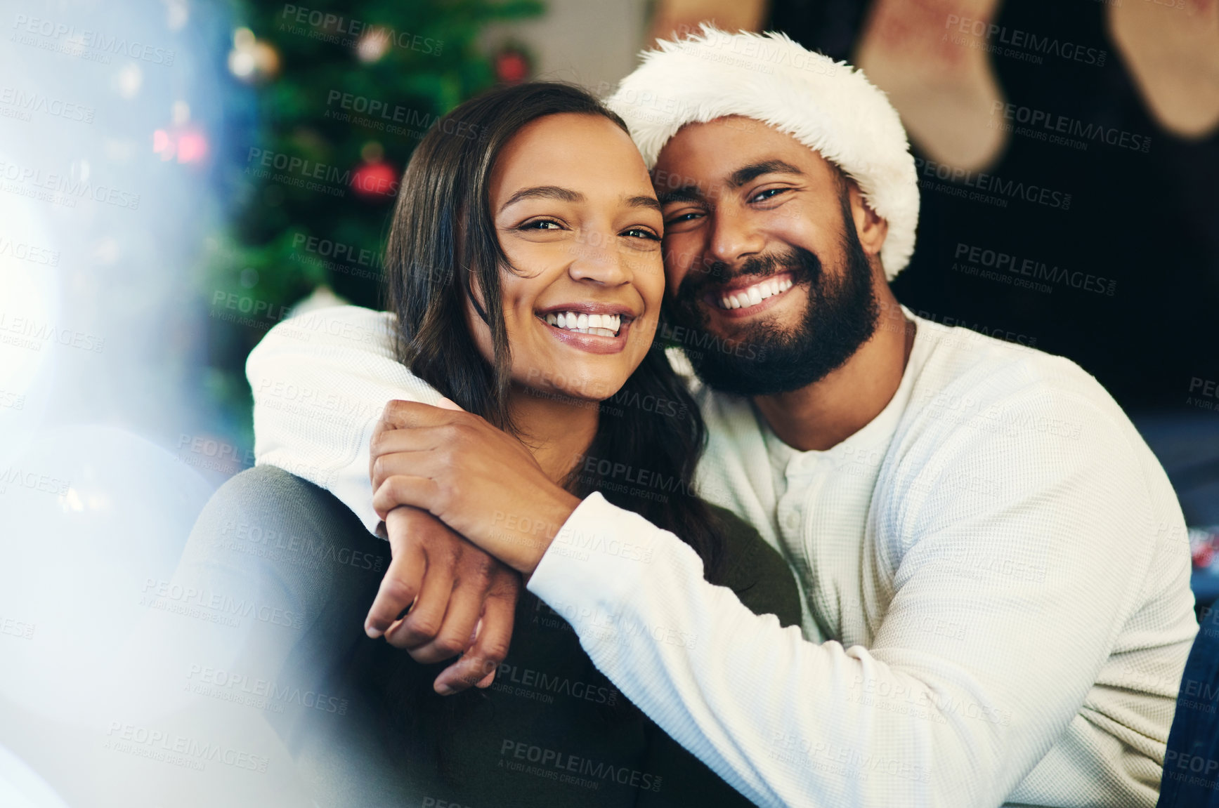 Buy stock photo Christmas, love and portrait of couple hug in celebration of a Christian winter holiday in house living room. Relax, marriage and happy woman enjoys quality time with romantic partner in New Zealand