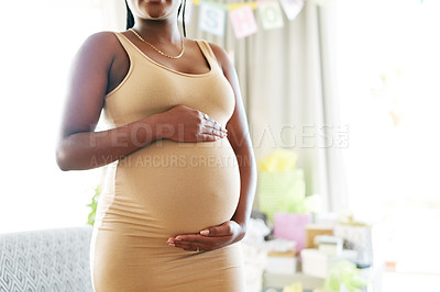 Buy stock photo Shot of a mother to be caressing her baby bump