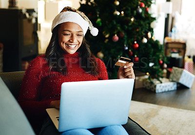 Buy stock photo Credit card, laptop and woman online shopping on Christmas day in living room. Fintech, xmas holiday and happy female from India on computer, virtual store or internet shop buying gifts or presents.