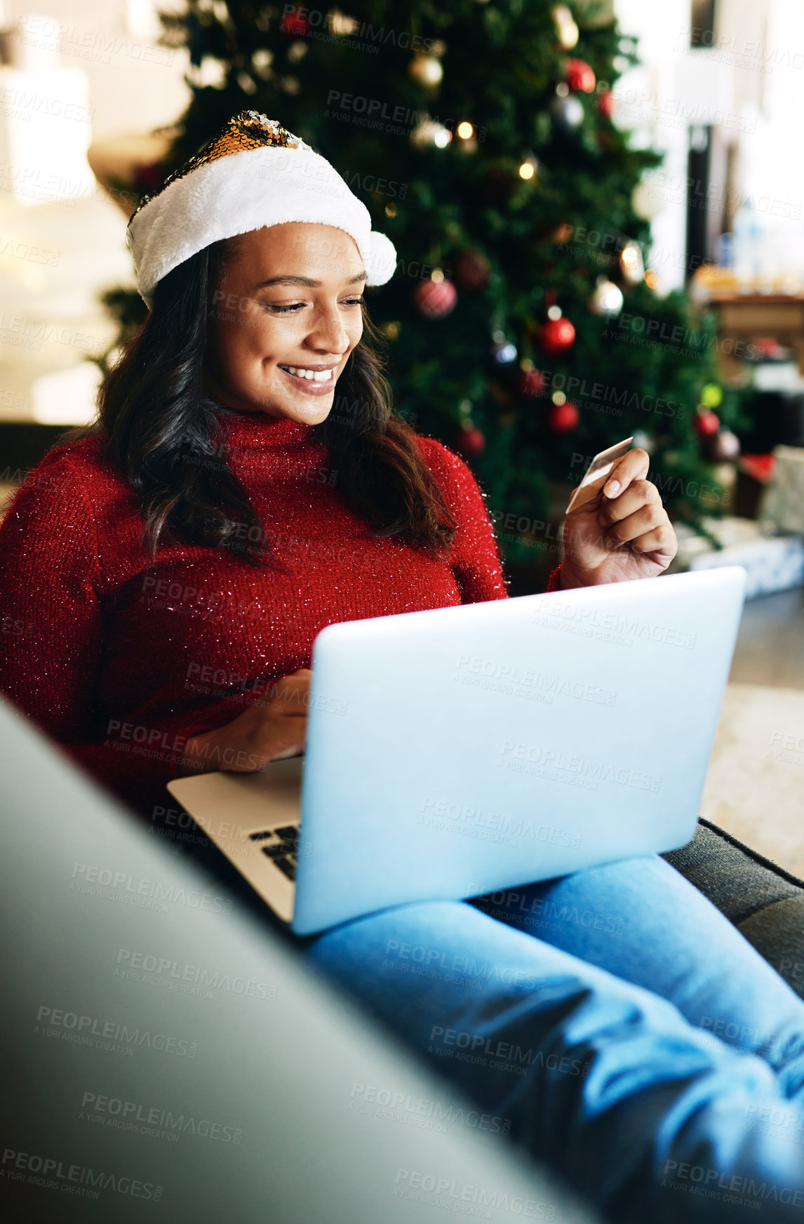 Buy stock photo Woman, Christmas and laptop with credit card for online shopping, happy and shop ecommerce store for gift. Black woman, smile and relax on sofa with tech, xmas holiday shopping or retail web store