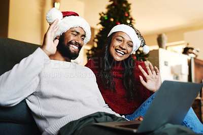 Buy stock photo Video call, laptop and Christmas couple on sofa with hello wave for global, international or virtual communication with friends or family. Happy black people on zoom call for holiday celebration chat