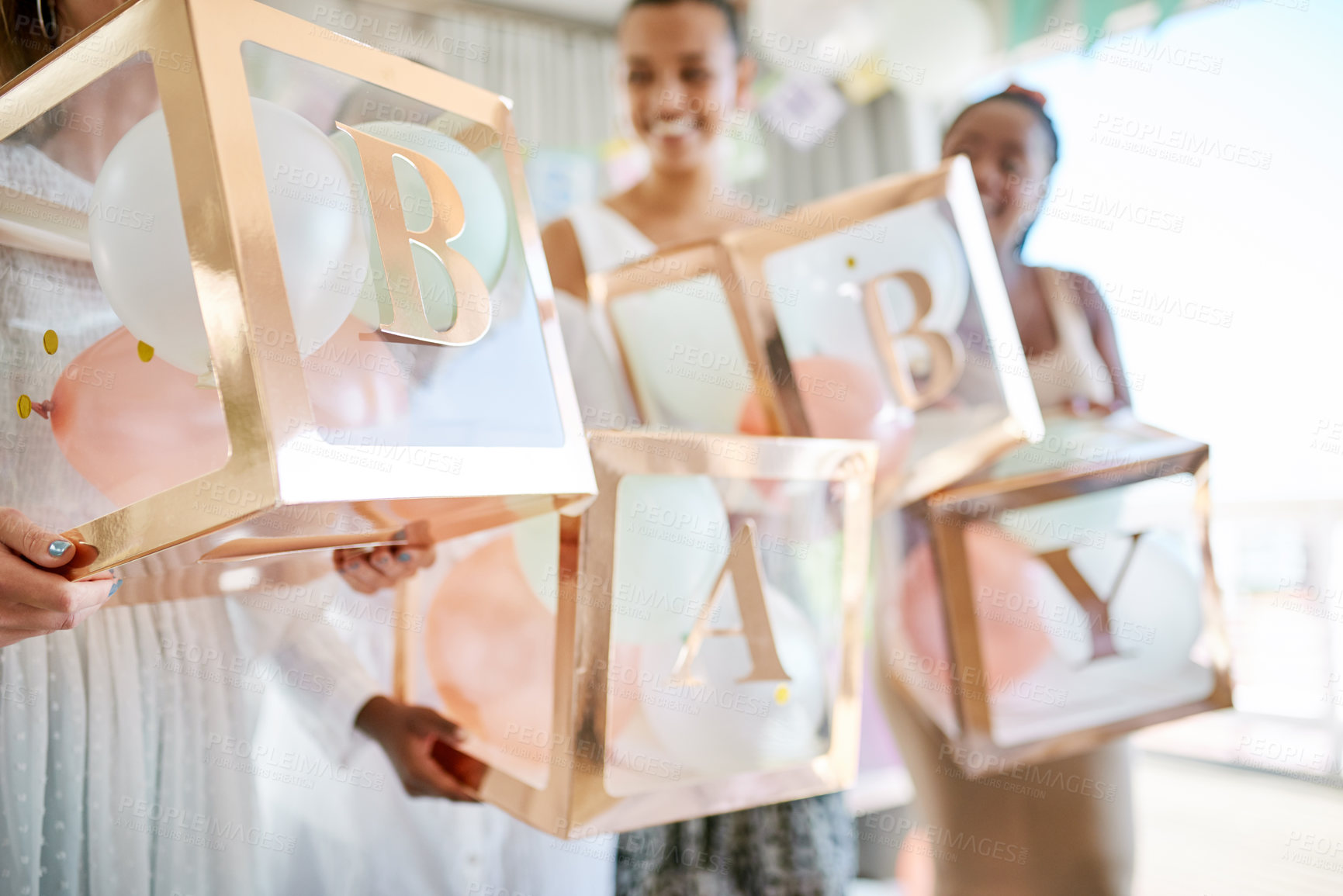 Buy stock photo Shot of a group of women holding a sign at a friends baby shower