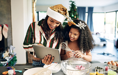 Buy stock photo Mother, child and tablet for christmas baking, cooking and holiday celebration for cookies or cake with family home wifi for app. Woman and girl or daughter learning food recipe together in kitchen