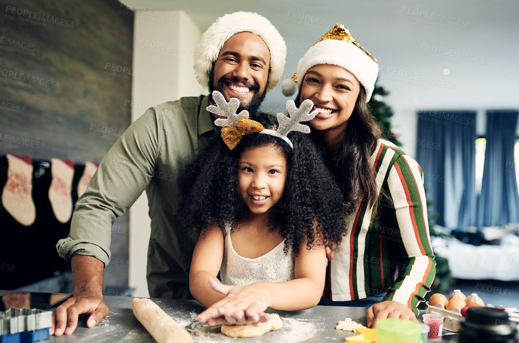 Buy stock photo Christmas, portrait and family baking cookies, cake or dessert for a holiday party at their house. Happy, smile and parents cooking festive sweet treats with their child in the kitchen for xmas event