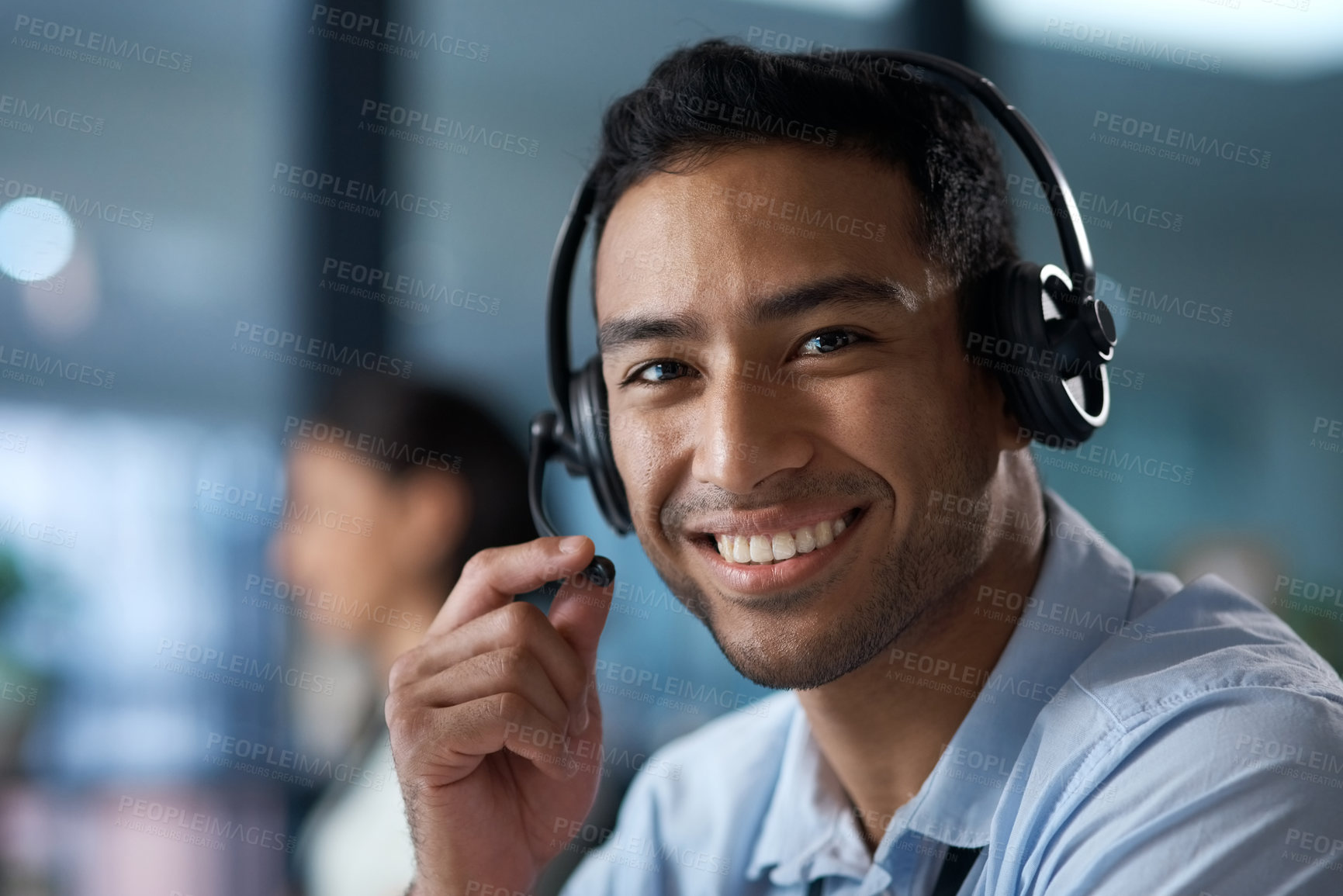 Buy stock photo Portrait of a young man using a headset in a modern office