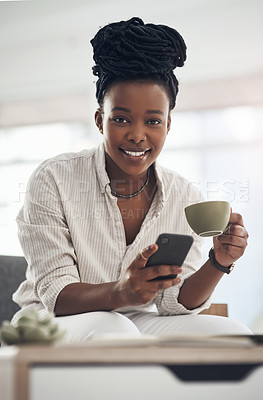 Buy stock photo Shot of a businesswoman using her smartphone to send text messages while drinking coffee