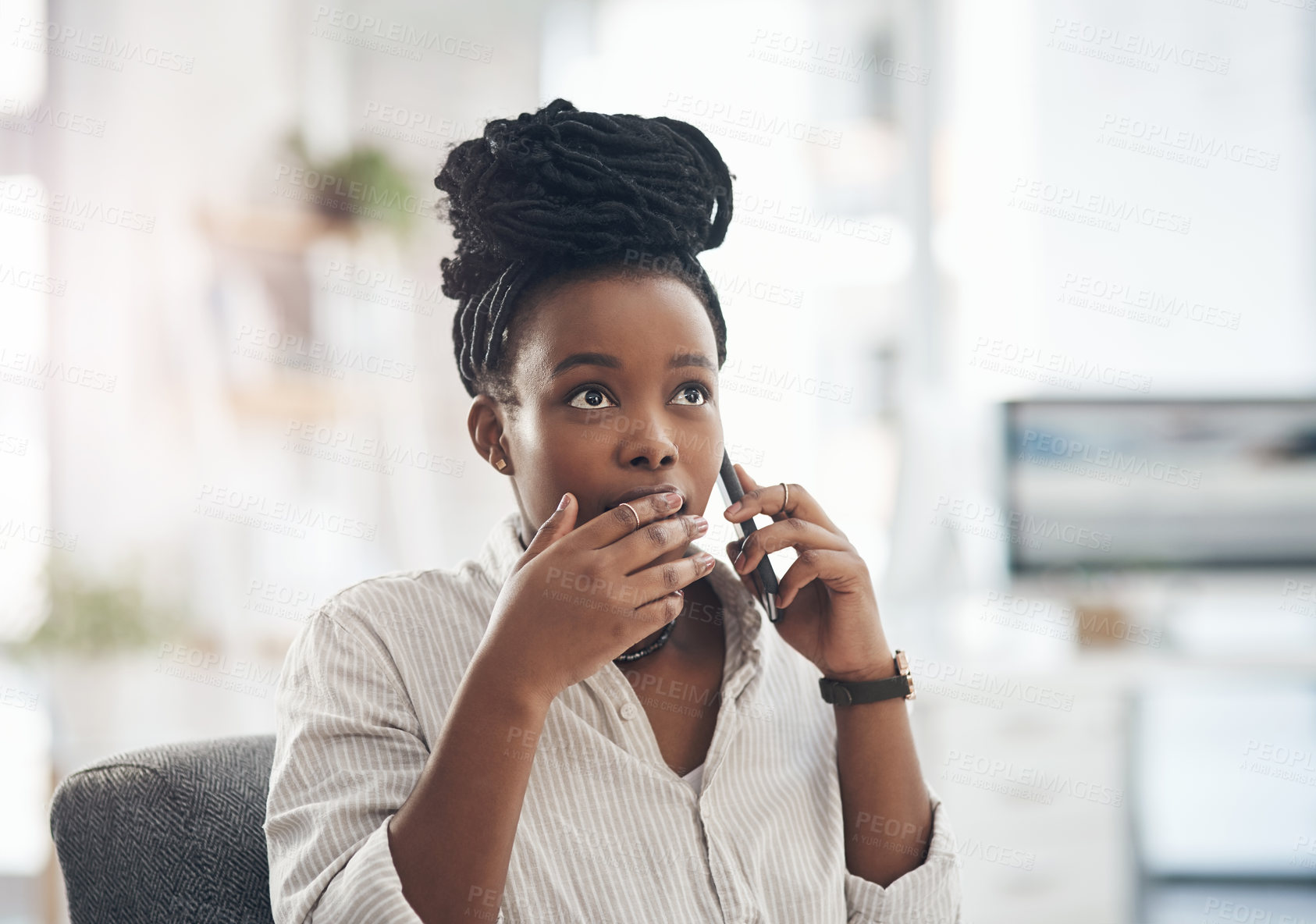 Buy stock photo Shot of a young businesswoman using her smartphone to make phone calls at the office