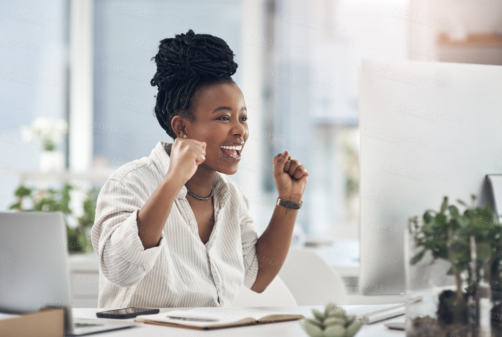 Buy stock photo Shot of a young business celebrating by cheering in her office