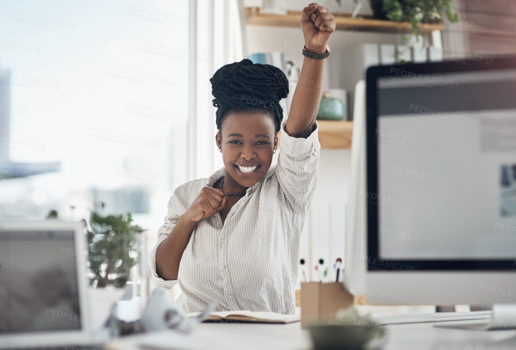 Buy stock photo Shot of a young business celebrating by cheering in her office