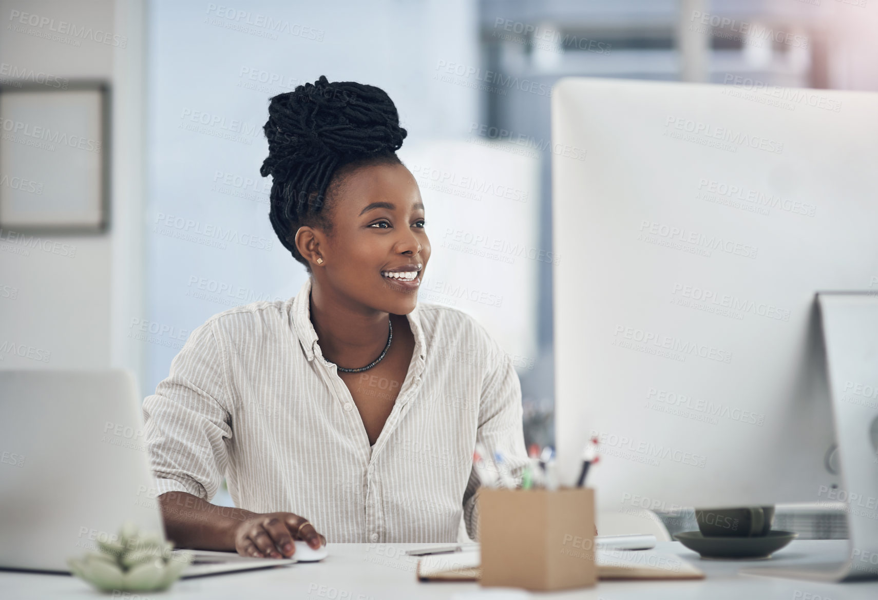 Buy stock photo Shot of a young businesswoman working at her desk in her office