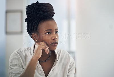 Buy stock photo Shot of a young businesswoman working on her desktop PC