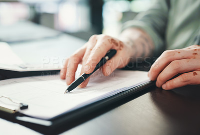 Buy stock photo Shot of an unrecognizazble businessman doing paperwork in an office at work